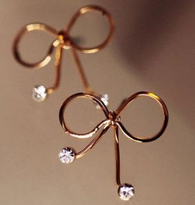 Golden Bow Tie on Diamond Earrings